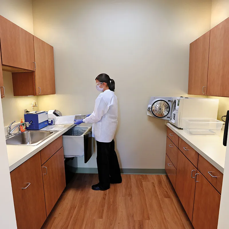 Staff member in the sterilization room